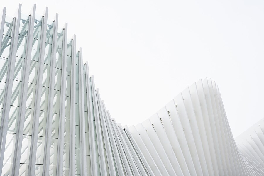 horizontal shot abstract buildings with white metallic ribs glass windows_181624 5395